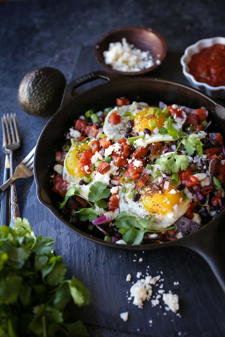 Sweet Potato Huevos Rancheros Nachos with black beans, avocado, sunny side up eggs, salsa, and more | TheRoastedRoot.net #dinner #breakfast #brunch #footballfood #glutenfree #appetizer