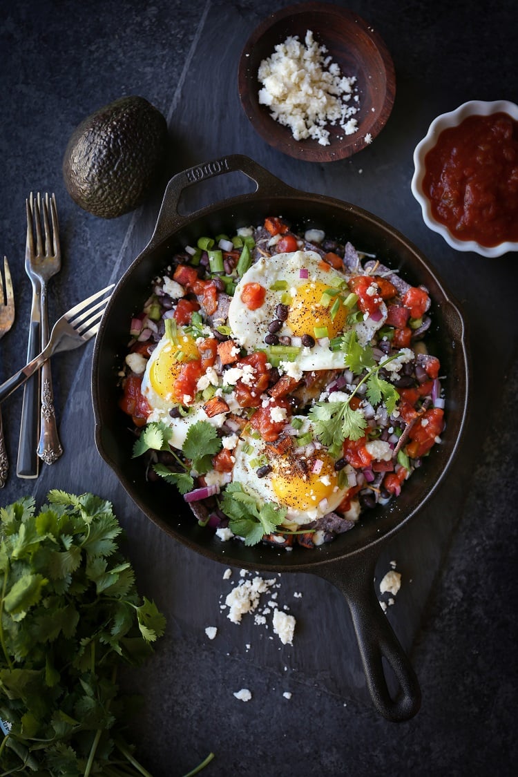 Sweet Potato Huevos Rancheros Nachos with black beans, avocado, sunny side up eggs, salsa, and more | TheRoastedRoot.net #dinner #breakfast #brunch #footballfood #glutenfree #appetizer