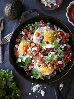 Sweet Potato Huevos Rancheros Nachos with black beans, avocado, sunny side up eggs, salsa, and more | TheRoastedRoot.net #dinner #breakfast #brunch #footballfood #glutenfree #appetizer