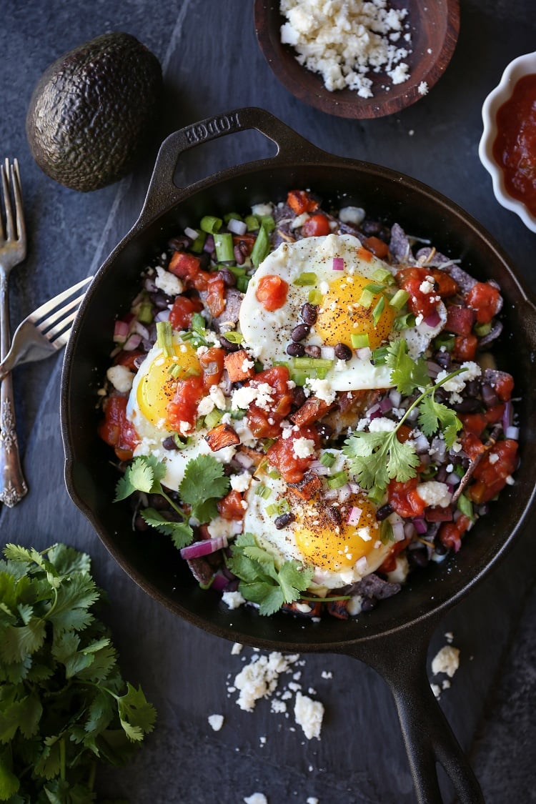 Sweet Potato Huevos Rancheros Nachos with black beans, avocado, sunny side up eggs, salsa, and more | TheRoastedRoot.net #dinner #breakfast #brunch #footballfood #glutenfree #appetizer