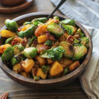 Cinnamon-Maple Sauteed Acorn Squash and Brussels Sprouts with Bacon | TheRoastedRoot.net #healthy #sidedish #paleo #holiday