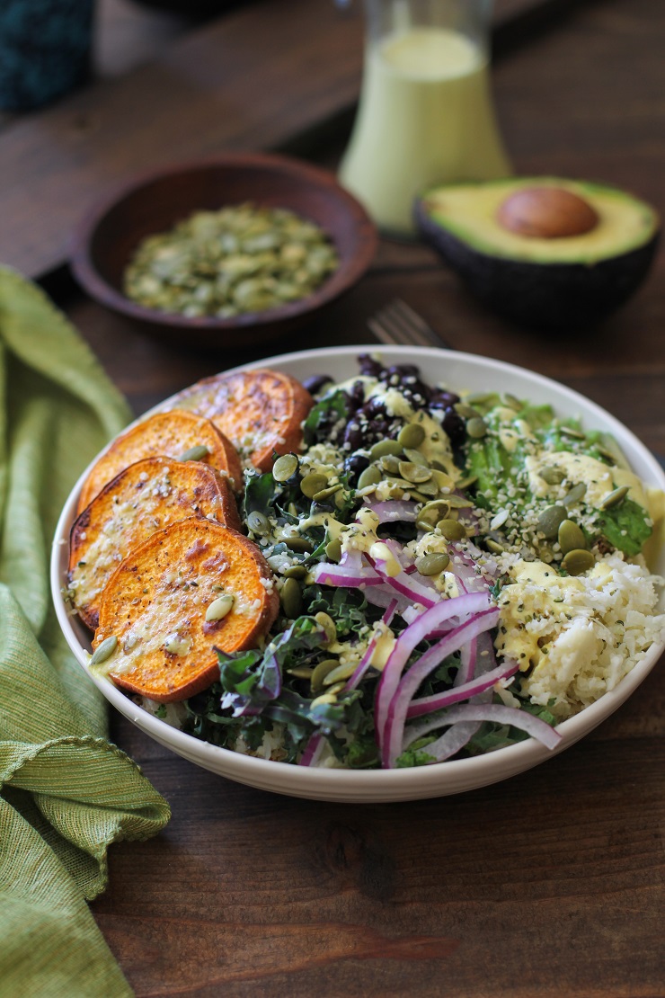 Roasted Sweet Potato and Cauliflower Rice Buddha Bowls with Turmeric Tahini Dressing | TheRoastedRoot.net #healthy #recipe #vegan #vegetarian