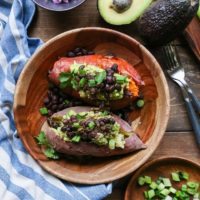 Guacamole and Black Bean Loaded Sweet Potatoes | TheRoastedRoot.net #healthy #glutenfree #recipe #vegan #vegetarian