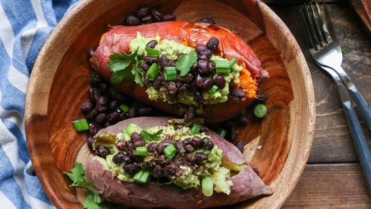 Guacamole and Black Bean Loaded Sweet Potatoes | TheRoastedRoot.net #healthy #glutenfree #recipe #vegan #vegetarian