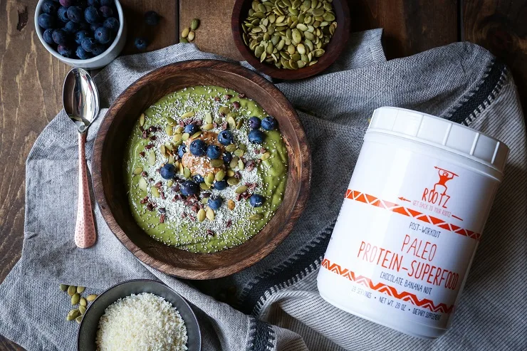 Superfood Green Smoothie Bowl with avocado, greens, cacao nibs, and blueberries | TheRoastedRoot.net #healthy #breakfast #snack