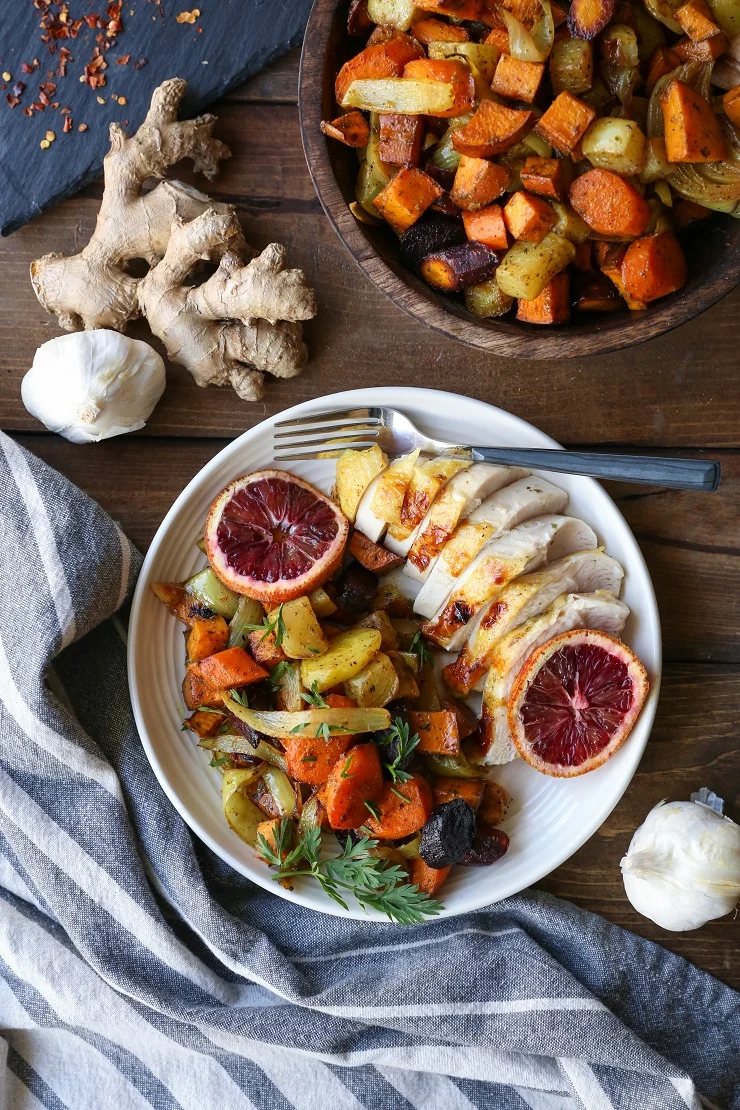 Orange Ginger Turmeric Whole Roast Chicken with Root Vegetables | TheRoastedRoot.net #healthy #recipe #dinner #paleo