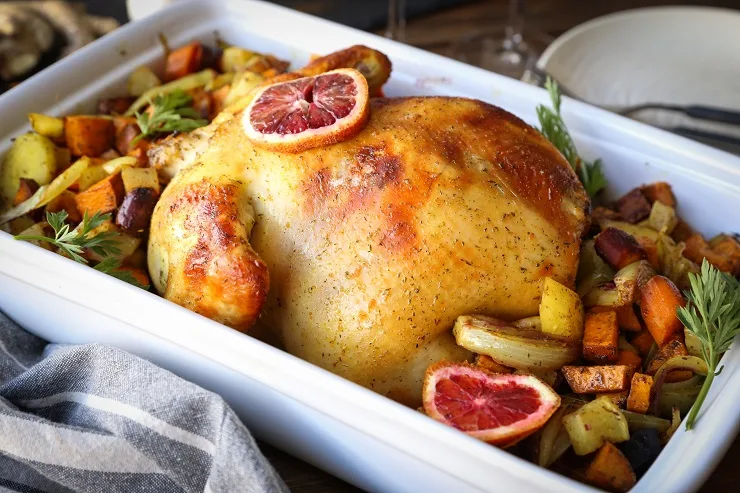 Orange Ginger Turmeric Whole Roast Chicken with Root Vegetables | TheRoastedRoot.net #healthy #recipe #dinner #paleo