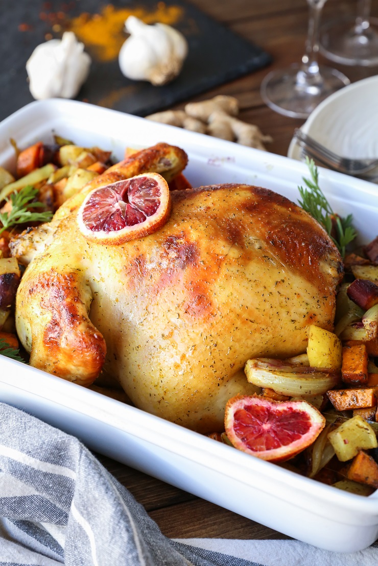 Orange Ginger Turmeric Whole Roast Chicken with Root Vegetables | TheRoastedRoot.net #healthy #recipe #dinner #paleo