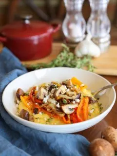 Creamy Polenta with Caramelized Onions, Peppers, and Mushrooms | TheRoastedRoot.net #vegetarian #glutenfree #dinner