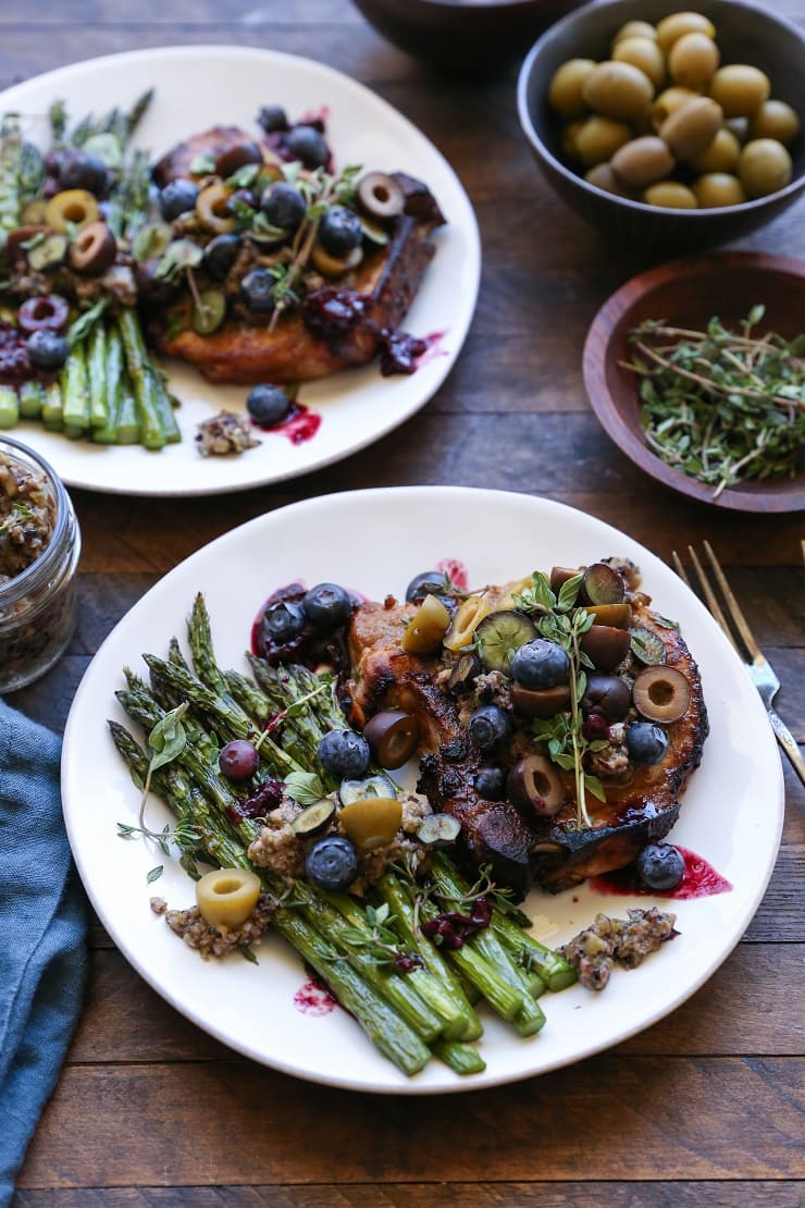 Skillet Pork Chops with Blueberry Olive Tapenade is a healthy and affordable weeknight meal that only requires a few ingredients and about 30 minutes to make. Paleo and packed with flavor!