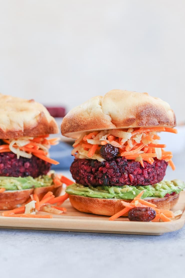 Beet and Black Bean Burgers with Carrot Slaw - a nutritious, filling vegan dinner recipe that only takes 30 minutes to make!