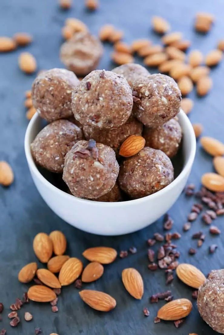 Paleo Fat Balls made with almonds, cacao nibs, coconut butter, and pure maple syrup. With a keto option! | TheRoastedRoot.net #healthysnack #glutenfree #grainfree