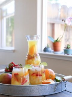 Tropical White Sangria - a naturally sweetened, cocktail recipe. So crisp, refreshing, and perfect for summer gatherings!