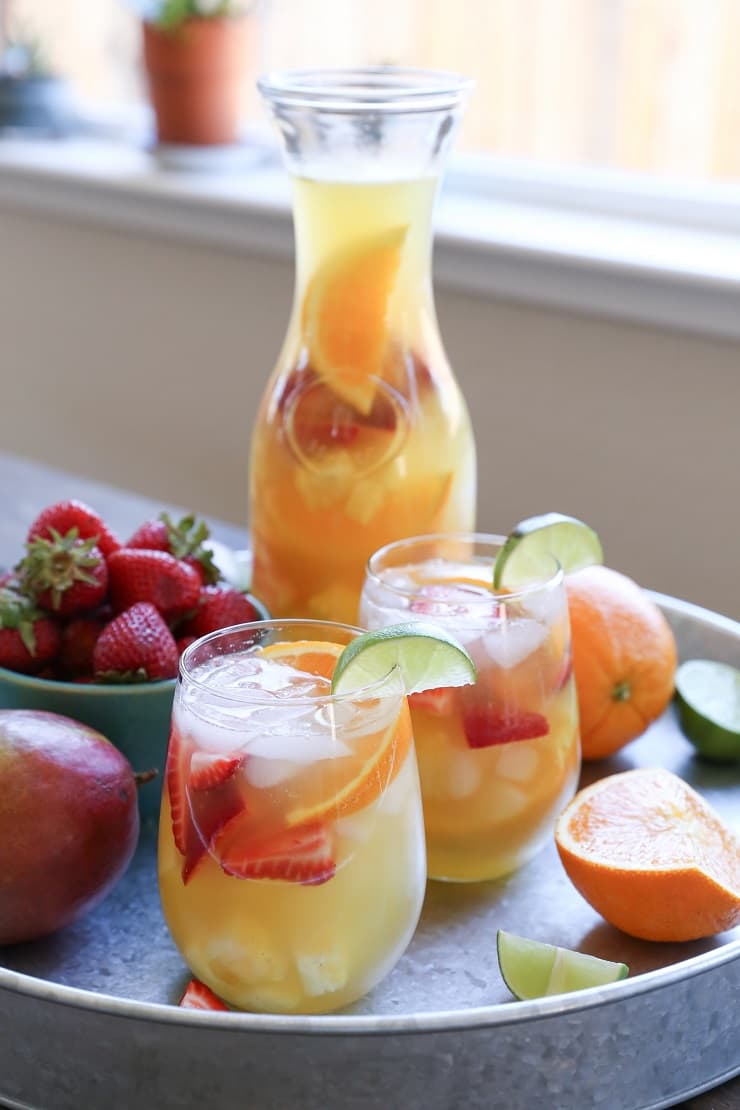 Tropical White Sangria - a naturally sweetened, cocktail recipe. So crisp, refreshing, and perfect for summer gatherings!