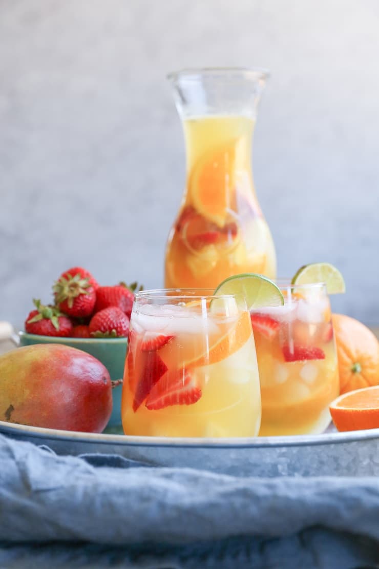 Tropical White Sangria - a naturally sweetened, cocktail recipe. So crisp, refreshing, and perfect for summer gatherings!