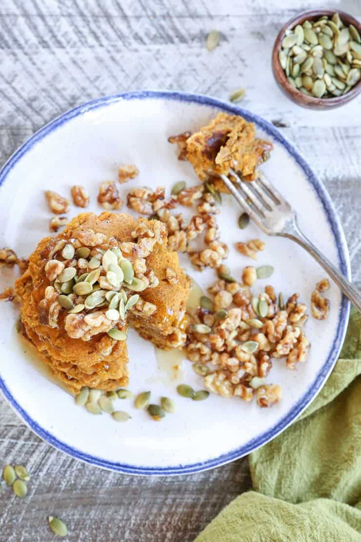 Vegan Pumpkin Pancakes with Maple-Toasted Walnuts and Pumpkin Seeds. You'd never know these pancakes are gluten-free and vegan!