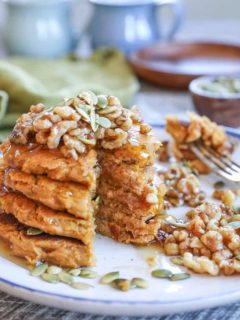 Vegan Pumpkin Pancakes with Maple-Toasted Walnuts and Pumpkin Seeds. You'd never know these pancakes are gluten-free and vegan!