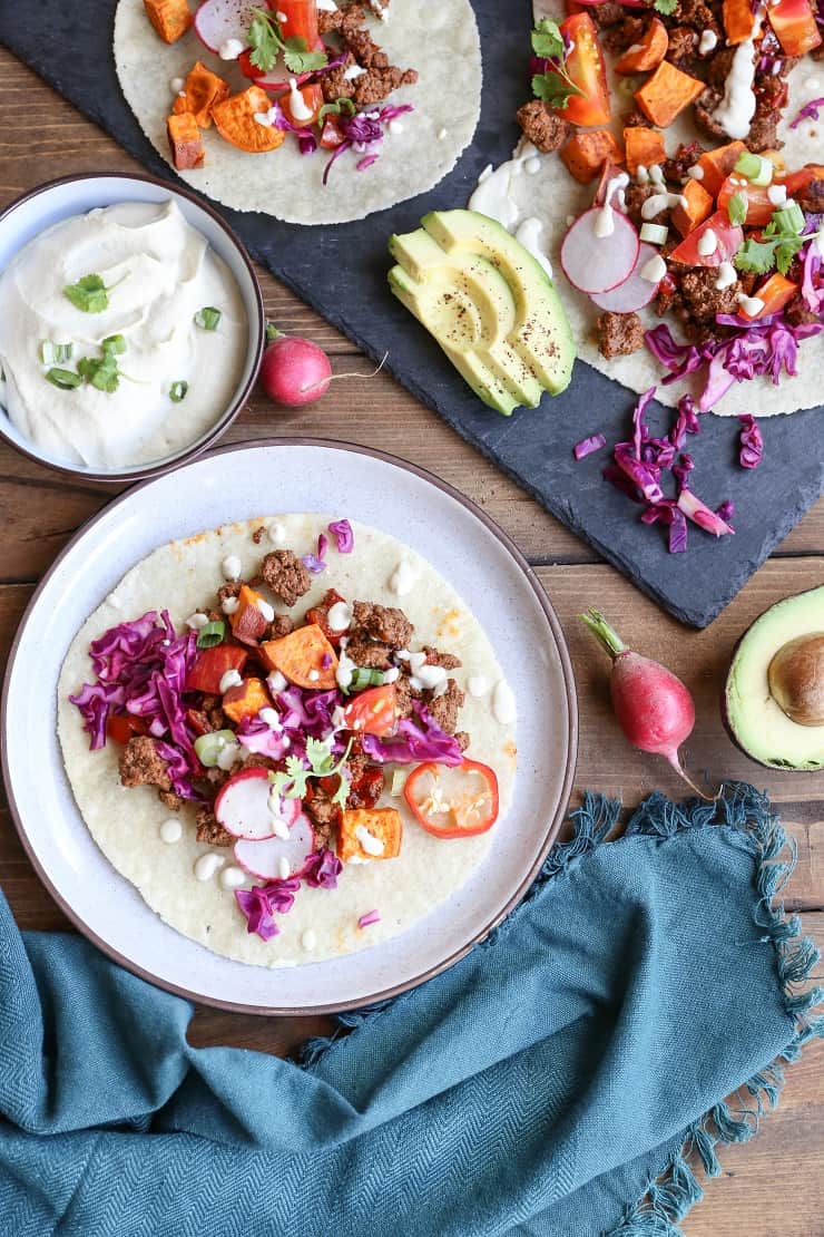 GROUND BEEF TACOS WITH ROASTED SWEET POTATOES AND VEGAN “QUESO” Ground Beef and Roasted Sweet Potato Tacos with Vegan "Queso" a beautifully seasoned and delightfully simple meal! #dinner #paleo #healthy
