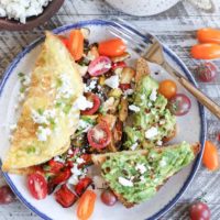 Late Summer Balsamic Roasted Vegetable Omelettes - this veggie-packed omelette includes zucchini, yellow squash, bell pepper, tomatoes, chives, and feta cheese for a winning breakfast.