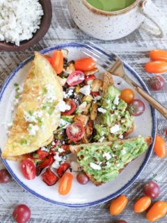 Late Summer Balsamic Roasted Vegetable Omelettes - this veggie-packed omelette includes zucchini, yellow squash, bell pepper, tomatoes, chives, and feta cheese for a winning breakfast.