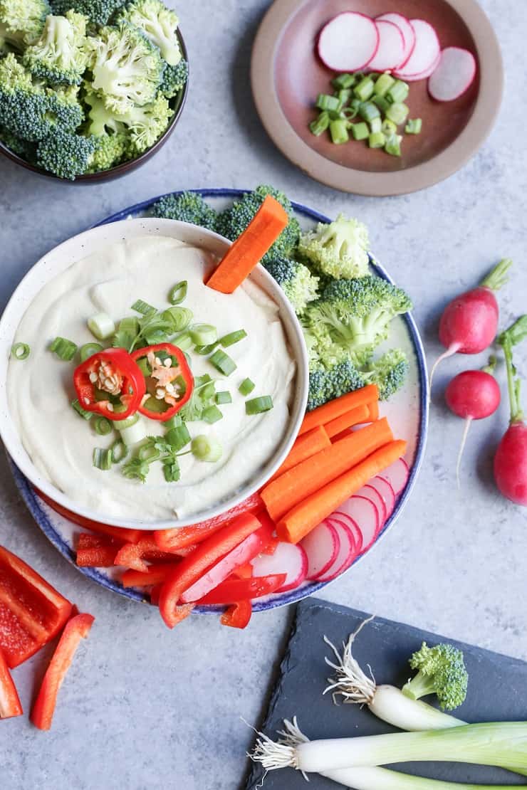 Paleo Sour Cream & Onion Dip - a luscious dip for chips and raw vegetables that's dairy-free, vegan, and paleo friendly. A healthier take on the classic dip!