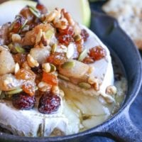 Maple-Spiced Pear Baked Brie with Walnuts, Pumpkin Seeds, and Golden Raisins - a lovely fall-inspired appetizer