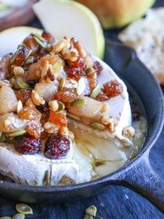 Maple-Spiced Pear Baked Brie with Walnuts, Pumpkin Seeds, and Golden Raisins - a lovely fall-inspired appetizer