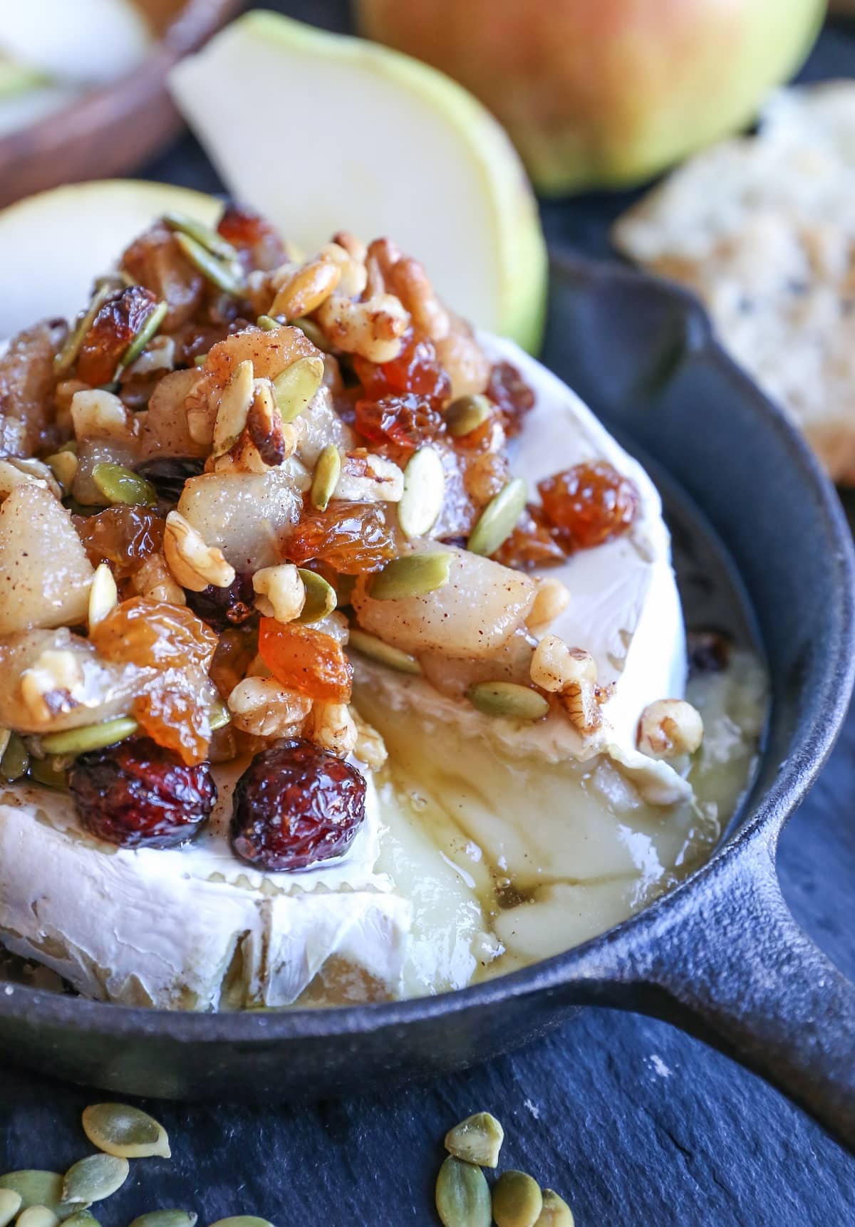 Maple-Spiced Pear Baked Brie with Walnuts, Pumpkin Seeds, and Golden Raisins - a lovely fall-inspired appetizer