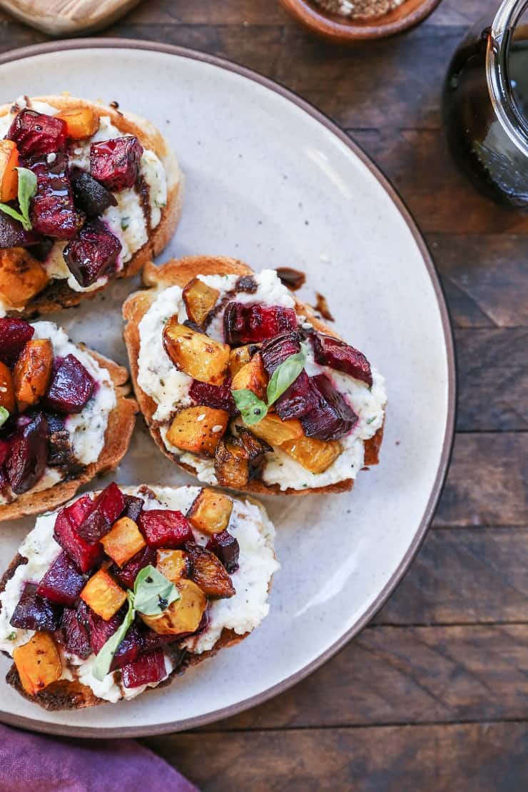 Roasted Beet and Vegan Herbed "Ricotta" Crostini with balsamic and honey drizzle - a nutritious, dairy-free appetizer