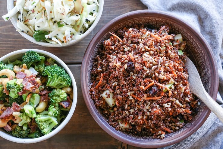 Detox spinach salad with quinoa, broccoli, cabbage, cashews, bacon, dried cranberries, and orange-ginger dressing #paleo #healthy #saladrecipe