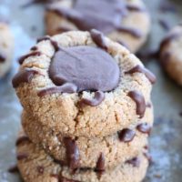 Paleo Chocolate Thumbprint Cookies - grain-free, dairy-free, naturally sweetened, made with almond flour, coconut oil, and pure maple syrup. This healthy gluten free cookie recipe is perfect for the holidays.