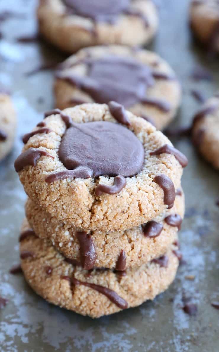 Paleo Chocolate Thumbprint Cookies - grain-free, dairy-free, naturally sweetened, made with almond flour, coconut oil, and pure maple syrup. This healthy gluten free cookie recipe is perfect for the holidays.