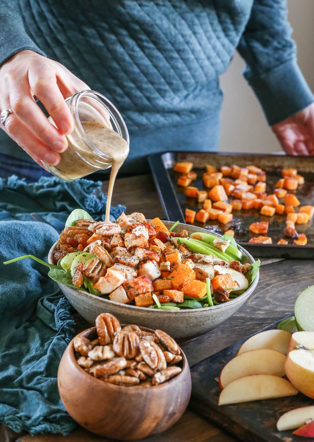 Roasted Butternut Squash Spinach Salad with apples, pecans,golden raisins, and cinnamon maple cider vinaigrette. A healthy whole30 paleo meal!