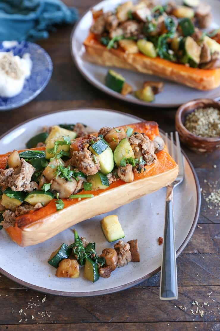 Turkey-Stuffed Butternut Squash with zucchini, mushrooms, and spinach. This healthy meal is paleo, AIP, and delicious!