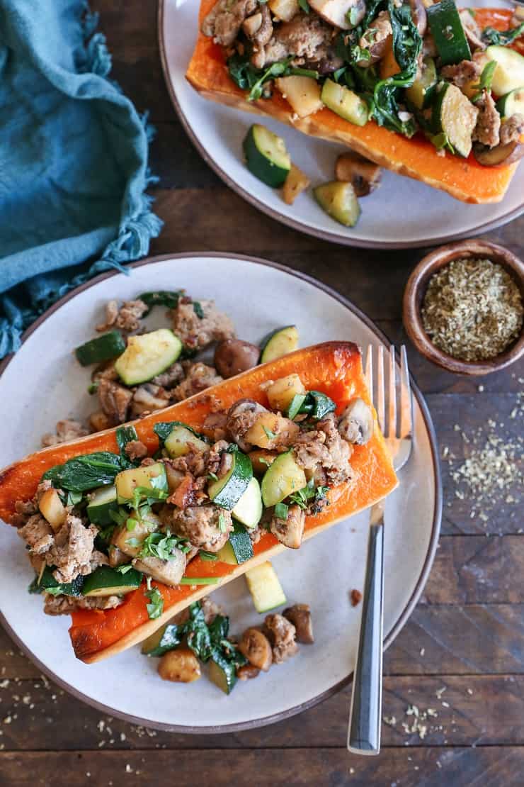 Turkey-Stuffed Butternut Squash with zucchini, mushrooms, and spinach. This healthy meal is paleo, AIP, and delicious!