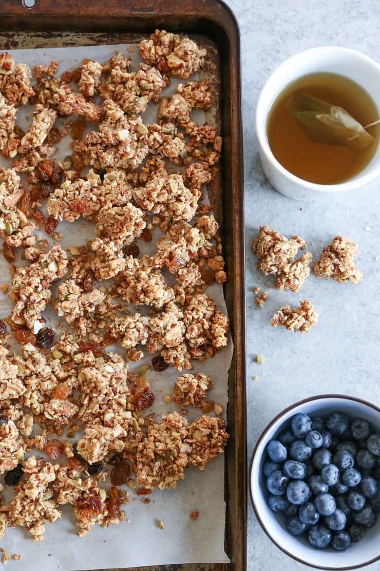 Cinnamon Raisin Paleo Granola (Vegan) - made with nuts, seeds, nut butter, and pure maple syrup for a nutritious gluten-free breakfast or snack.