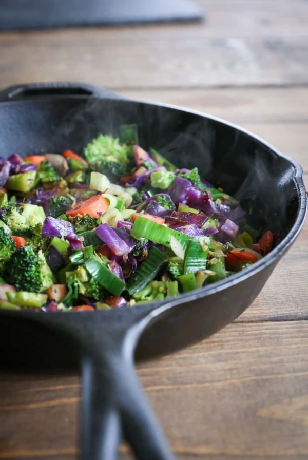 cast iron skillet of stir fry vegetables