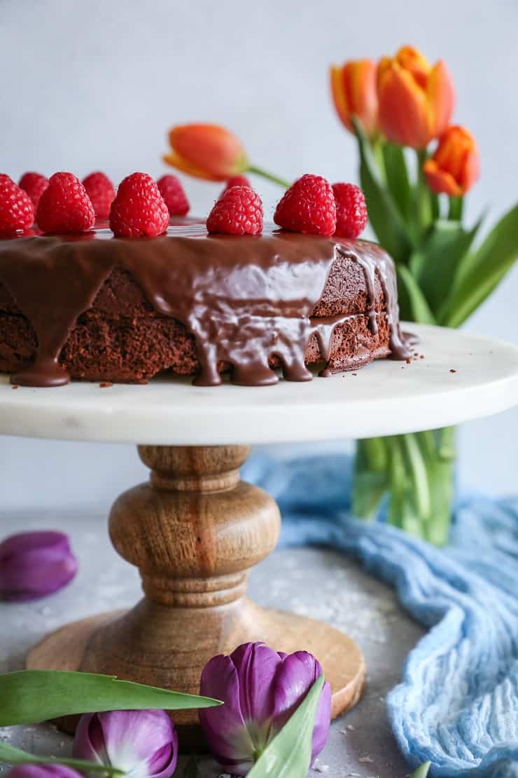 Paleo Chocolate Cake with chocolate ganache - made grain-free, refined sugar-free, and dairy-free with almond flour, coconut oil, and pure maple syrup