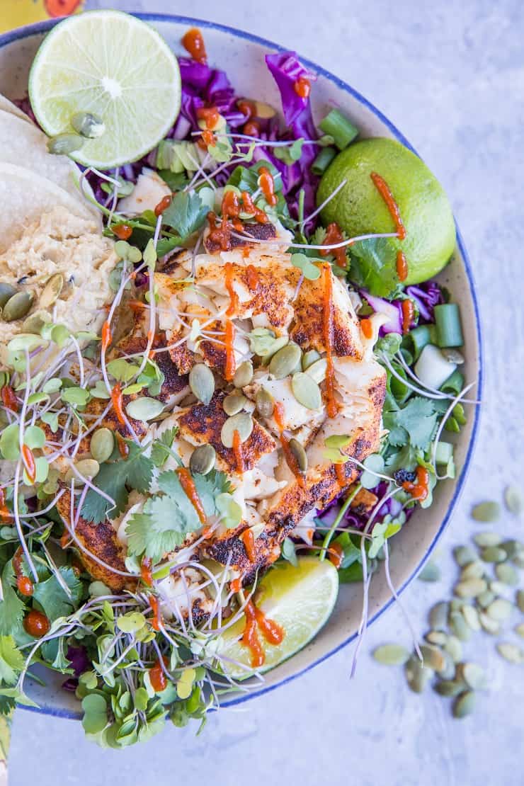 Baja Fish Taco Bowl with spicy halibut, avocado crema, and red cabbage makes for a fresh and vibrant meal