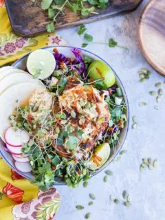 Baja Fish Taco Bowl with spicy halibut, avocado crema, and red cabbage makes for a fresh and vibrant meal