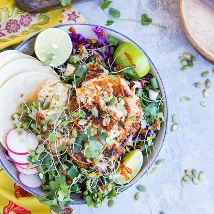 Baja Fish Taco Bowl with spicy halibut, avocado crema, and red cabbage makes for a fresh and vibrant meal