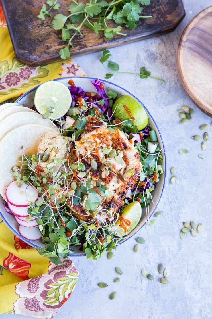 Baja Fish Taco Bowl with spicy halibut, avocado crema, and red cabbage makes for a fresh and vibrant meal