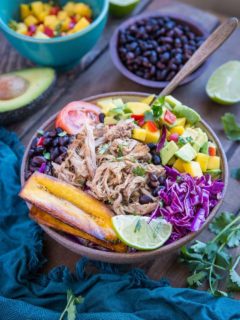 Crock Pot Carnitas Burrito Bowls with mango salsa, black beans, fried plantains, and shredded cabbage