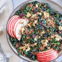 Hormone-Supporting Kale and Quinoa Salad with pumpkin seeds, apple, dried cranberries, and walnuts. This nutrient-dense salad is perfect for eating throughout the week.