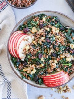 Hormone-Supporting Kale and Quinoa Salad with pumpkin seeds, apple, dried cranberries, and walnuts. This nutrient-dense salad is perfect for eating throughout the week.