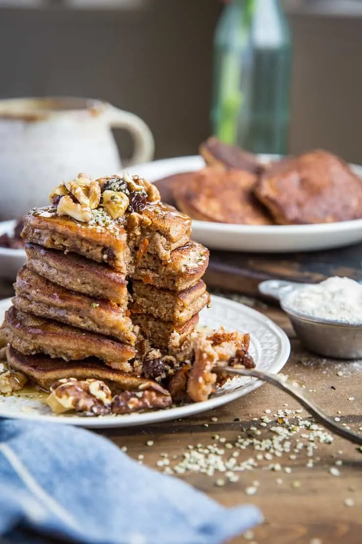 Paleo Carrot Cake Pancakes made grain-free with coconut flour. This healthy pancake recipe is refined sugar-free, dairy-free, and delcious.
