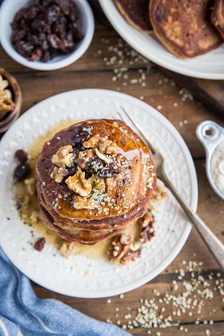 Healthy Paleo Carrot Cake Pancakes made with coconut flour and pure maple syrup. This healthy pancake recipe is grain-free, refined sugar-free, dairy-free, and delicious.
