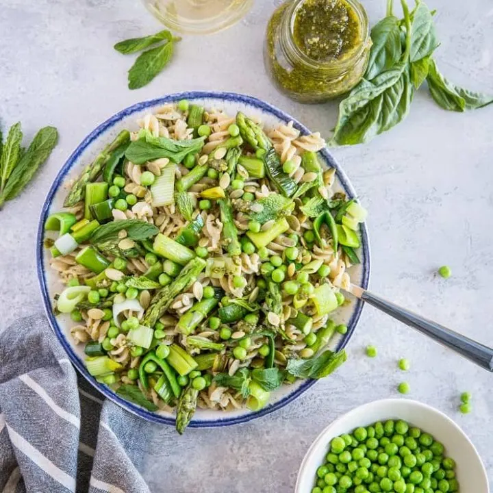 Spring Green Pasta with Vegan Basil-Mint Pesto - a healthy pasta recipe with asparagus, peas, leek, and homemade pesto sauce