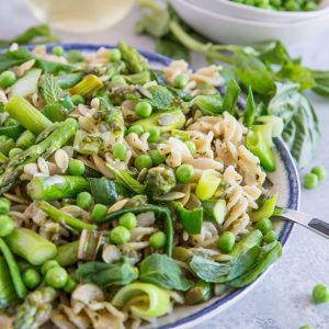 Spring Green Pasta with Vegan Basil-Mint Pesto Sauce - gluten-free pasta with asparagus, leek, peas, pumpkin seeds, and homemade vegan pesto