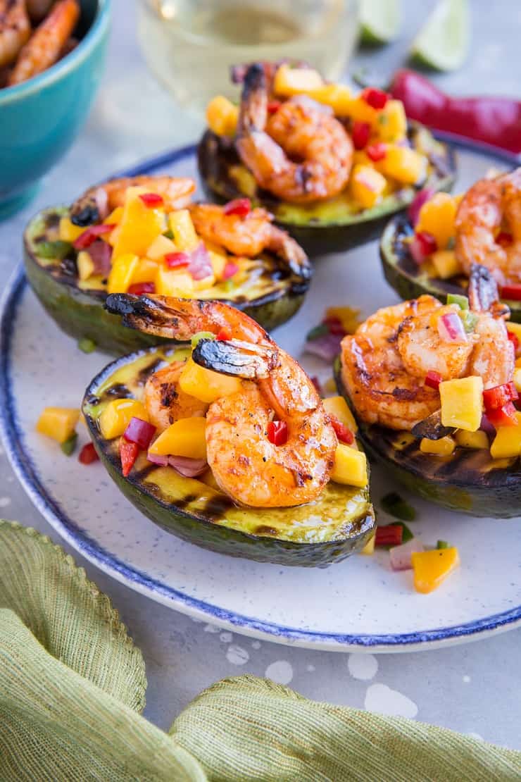 Stuffed Grilled Avocados with Grilled Shrimp and Mango Salsa - a healthy paleo appetizer perfect for BBQ season - whole30 approved and delicious